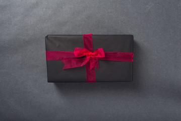 Gift box with red ribbon, top view