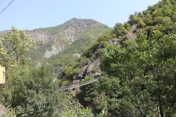 Suspension bridge over a mountain stream