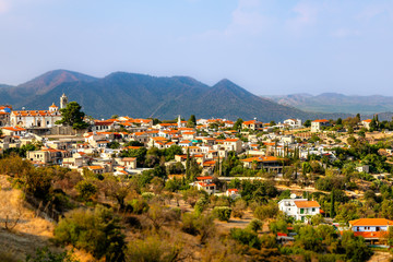 Panorama of Lefkara, traditional Cypriot village with red rooftop houses and mountains in the background, Larnaca district, Cyprus