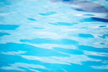 Fototapeta na wymiar Water wave on surface in swimming pool, abstract background