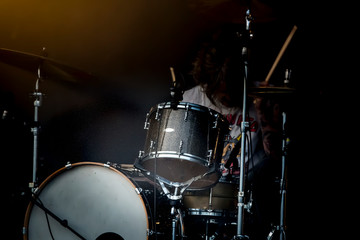 Fototapeta na wymiar Man drum instrument performing at stage rock music.