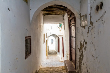 Fototapeta na wymiar Narrow medieval street in the white medina of the Tetouan city, Morocco in Africa