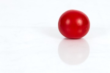Cherry Tomato against a white background