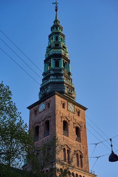 View on tower St. Nicholas Church in the historic center or old town of Copenhagen, Denmark 