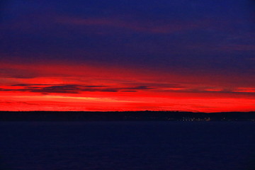 A color image of a sunset over the North Sea as seen from the balcony of a cruise ship.