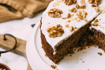 Carrot Cake with Cream Cheese Icing and walnut. Vegan and gluten free concept