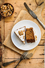 Carrot Cake with Cream Cheese Icing and walnut. Vegan and gluten free concept