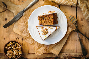 Carrot Cake with Cream Cheese Icing and walnut. Vegan and gluten free concept