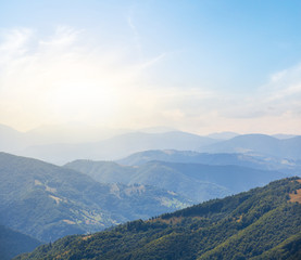 green mountain valley in a blue nist at the sunset