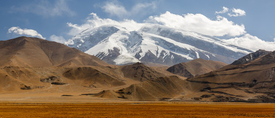 LAKE KARAKUL, XINJIANG / CHINA - October 3, 2017: Panorama view on Muztagata Mountain, captured...