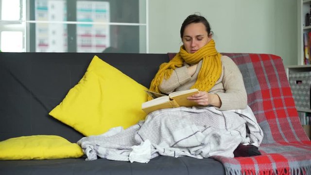 Woman is Measuring Temperature and Reading the Book