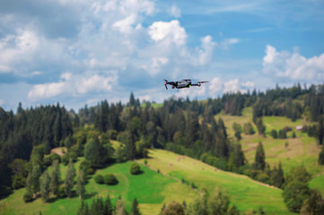 Fototapeta na wymiar drone quadcopter with digital camera flying in mountain