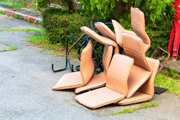 office chair leather brown old damage dirty heap on the floor road