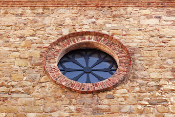 rose window at the facade of an italian church