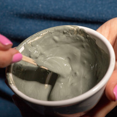 A woman makes a cosmetic mask