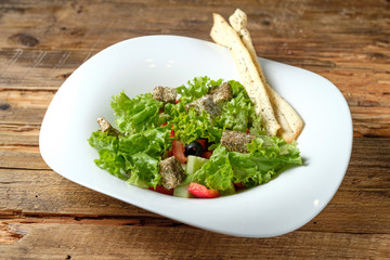 Vegetarian salad with cheese and vegetables