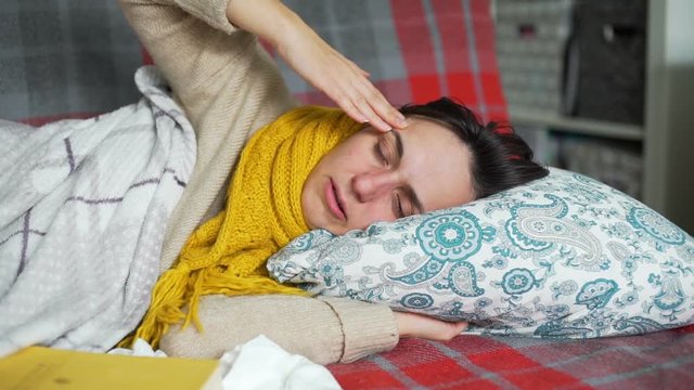 Young Woman in a Bed with a Cold