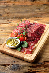 Cutting board with assorted smoked meat