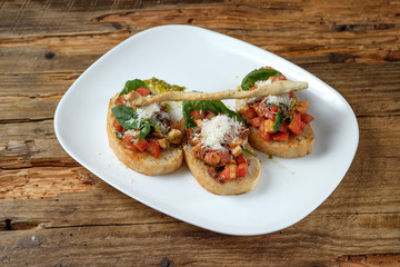Bruschetta with fresh tomatoes, parmesan and basil