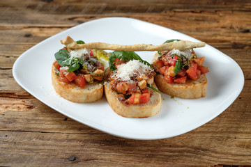 Bruschetta with fresh tomatoes, parmesan and basil