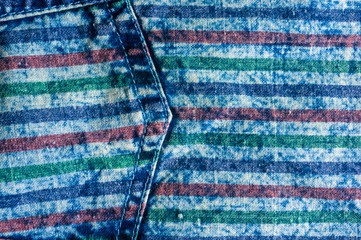 Blue washed faded jeans striped texture with seams, clasps, buttons and rivets