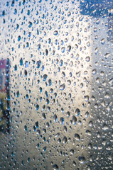 background of raindrops on window glass, close up