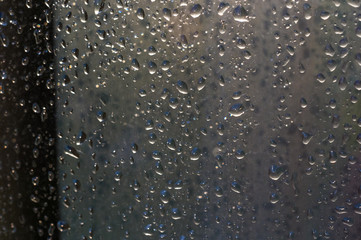 background of raindrops on window glass, close up