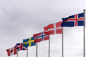 Flags on flagpoles from Iceland, Denmark, Norway, Sweden, United Kingdom and Canada