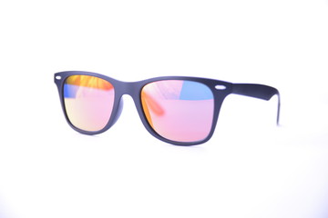 Black-rimmed sunglasses with rainbow glasses on a white background isolated