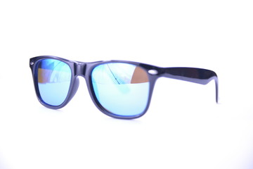 Sunglasses in a black frame with blue glasses on a white background, isolated