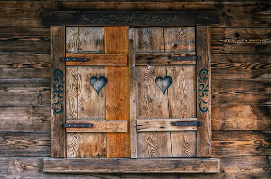 Wooden old window with shuttered patterns
