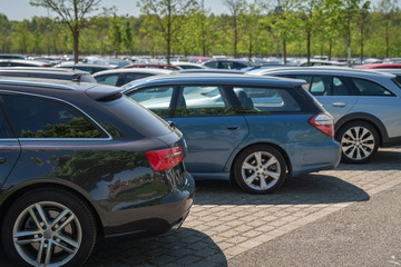 row of cars in parking lot