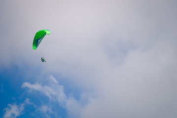 Paraglider in the cloudy sky