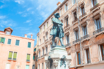 Fototapeta na wymiar Statue of Carlo Goldini the most famous playwrights of Italy 