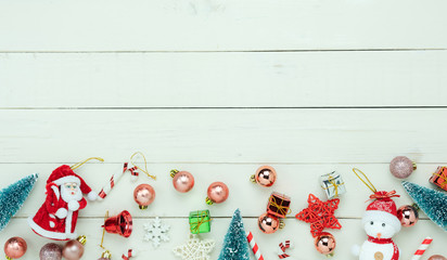 Table top view of Merry Christmas decorations & Happy new year ornaments concept.Flat lay essential difference objects decor & fir tree on modern white wooden background at home studio office desk.