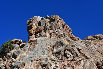 Tibet, one of the geoglyphs on  rock on the shore of the sacred lake Nam-Tso (Nam Tso) against the blue sky, 4718 meters above sea level