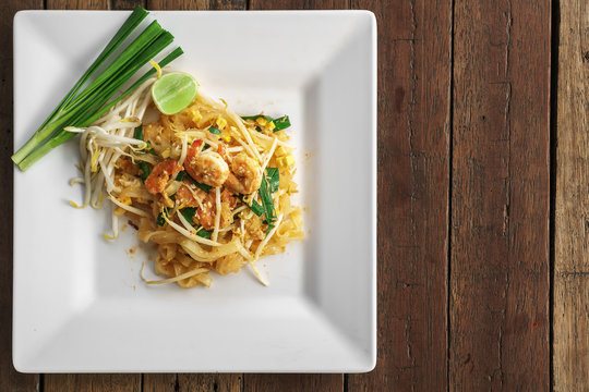 Top View Overhead Photo, Traditional Thai Food, Shrimp Pad Thai Noodle On White Dish