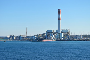 Fototapeta na wymiar Civitavecchia, Italy, ENEL tower, coal-fired power plant