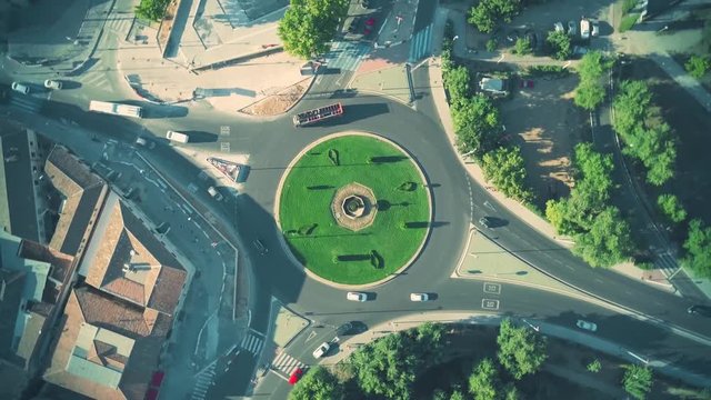 Aerial top down time lapse of roundabout traffic in Spanish town