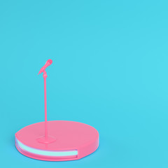 Stage with microphone on bright blue background in pastel colors