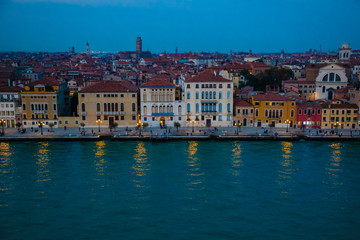 Fototapeta na wymiar Night view of old houses on Grand Canal in Venice in Italy