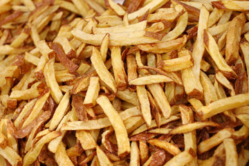 French fries. French fries all frame background texture.  Tasty fried potatoes. Yummy french fries as background. Flat lay, top view. delicious Crispy fried Sweet Potato Stick – snack. Freshsh chips 
