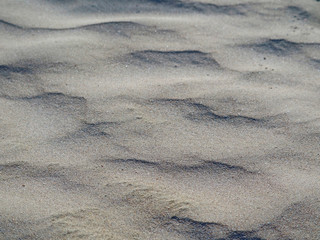 close up of natural looking flat sandy ground on the beach