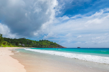 Fototapeta na wymiar Untouched sandy beach with beautiful rocks and turquoise sea in Paradise island. 