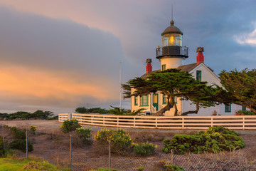 California lighthouse with dramatic sky. Point Pinos lighthouse  at sunset in Pacific Grove,...