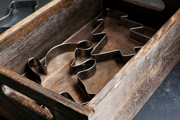 Christmas tree and santa claus cookie cutter in wooden box, high angle view, copy space