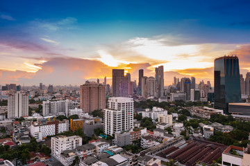 Fototapeta na wymiar cityscape Bangkok sunset skyline, Thailand. Bangkok is metropolis and favorite of tourists live at between modern building / skyscraper, Community residents