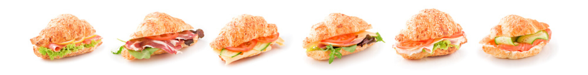 Assorted croissant sandwiches on a white surfase isolated. Banner.