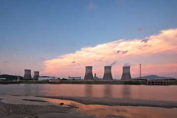 power plant with sunset