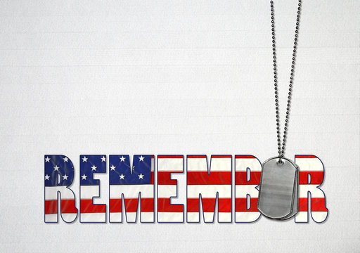 word remember with flag design and military dog tags on gray wood background